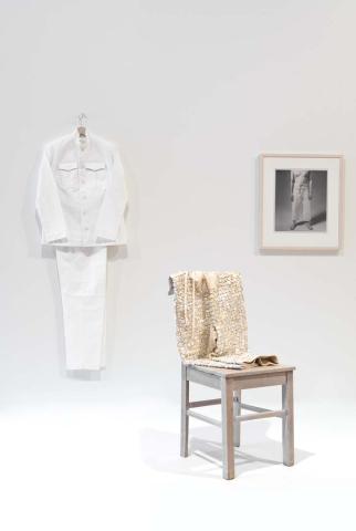 Artwork No work for a white man this artwork made of Blanket under-trousers with mother-of-pearl buttons and cotton thread; chair; white cotton-drill suit made by Adriana Loro; coat hanger; photograph: Michael Kluvanek, wooden frame, glass, created in 2006-01-01