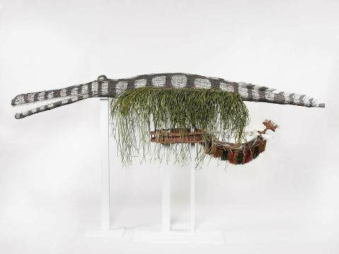 Artwork Palingawi (Freshwater crocodile) this artwork made of Mask: woven split cane with cowrie shells and natural ochres, cordyline leaves, grass fibres, created in 2011-01-01