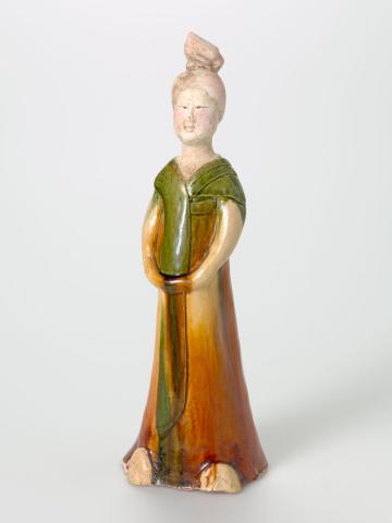 Artwork Figure of a lady wearing a robe this artwork made of Cast earthenware, sancai glaze, created in 0600-01-01