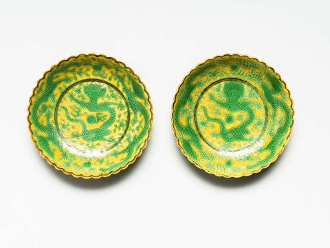 Artwork Pair of imperial dragon dishes this artwork made of Porcelain, yellow and green glaze, scalloped rims, created in 1875-01-01