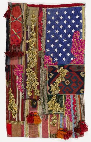 Artwork Glorious Haze this artwork made of Handwoven textiles, silver braid, keys, a brass chain, military emblems, pins, buttons and bullet casings, and a sweet heart pendant from an American World War 2 soldier on vintage American flag
