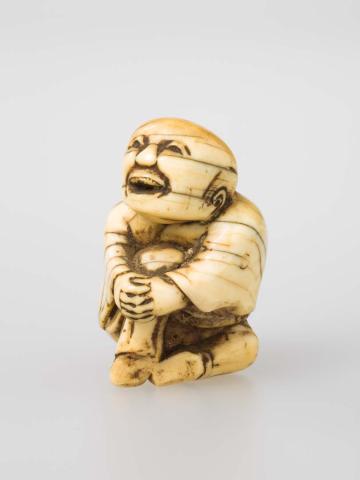 Artwork Netsuke: (figure) this artwork made of Carved ivory, created in 1800-01-01