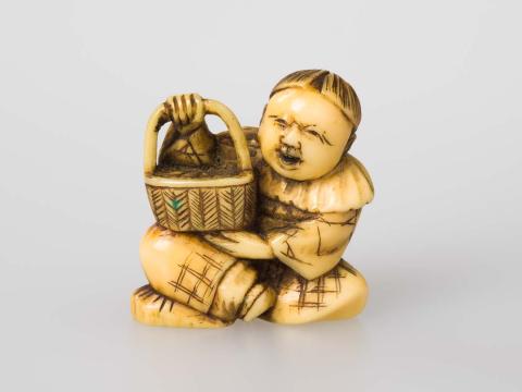 Artwork Netsuke: (figure with basket) this artwork made of Carved ivory, created in 1800-01-01