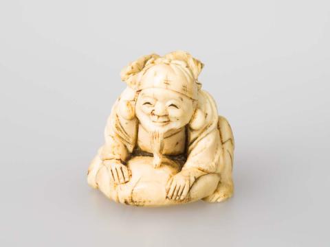 Artwork Netsuke: (figure with fish) this artwork made of Carved ivory, created in 1800-01-01