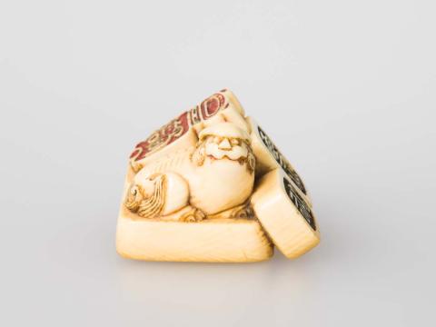 Artwork Netsuke: (stamps) this artwork made of Carved ivory, created in 1800-01-01