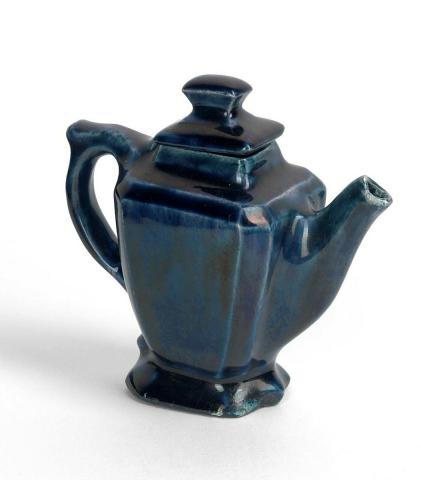 Artwork Miniature teapot this artwork made of Earthenware, slip cast (?) with deep blue/green glaze, created in 1925-01-01