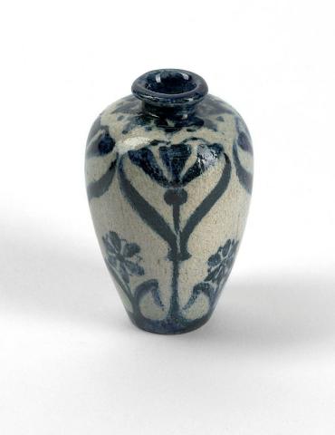 Artwork Miniature ovoid pot this artwork made of Earthenware, hand built, with formal iris and daisy pattern in blue, created in 1930-01-01
