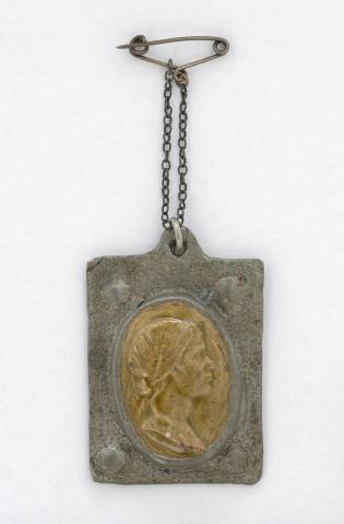 Artwork Cameo pendant this artwork made of Green ceramic profile (cast by LJ Harvey) set in a rectangular hand-beaten pewter frame, created in 1930-01-01
