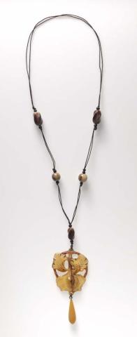 Artwork Orchid pendant necklace this artwork made of Horn, yellow glass, silk chord, created in 1895-01-01