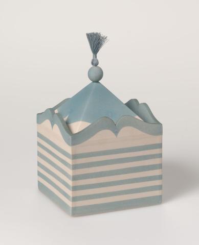 Artwork Jewel box this artwork made of White stoneware with a slip cast lid with cotton thread tassel and slab built body, created in 1984-01-01