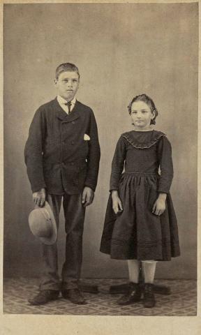 Artwork (Young boy and girl) this artwork made of Albumen photograph on paper mounted on card, created in 1879-01-01
