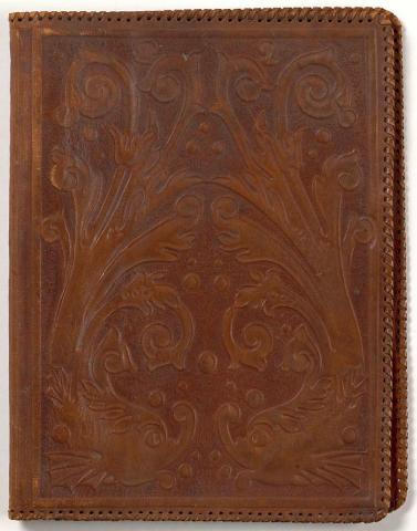 Artwork Telephone book cover this artwork made of Leather carved with a design of fish in the neo-renaissance manner. Edges bound leather, created in 1935-01-01