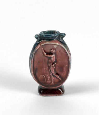 Artwork Flask with cameo of Neptune this artwork made of Earthenware, press moulded with cameo and blue and red glaze, created in 1920-01-01