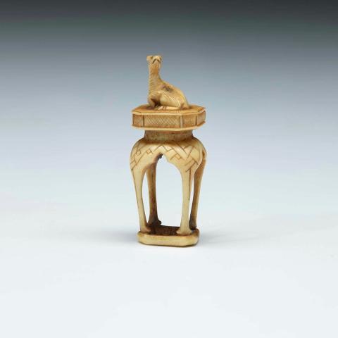 Artwork Netsuke:  (faun on pedestal) this artwork made of Ivory, carved and incised, created in 1800-01-01