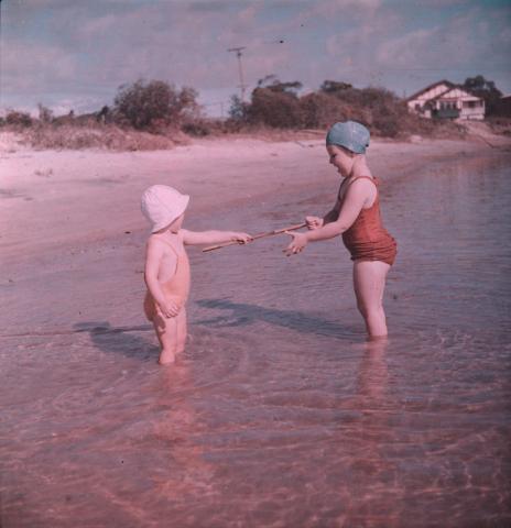 Artwork (Rosemary and Margaret with a stick in shallow water) this artwork made of Cellulose acetate Dufay colour transparency (originally in a glass mount), created in 1935-01-01