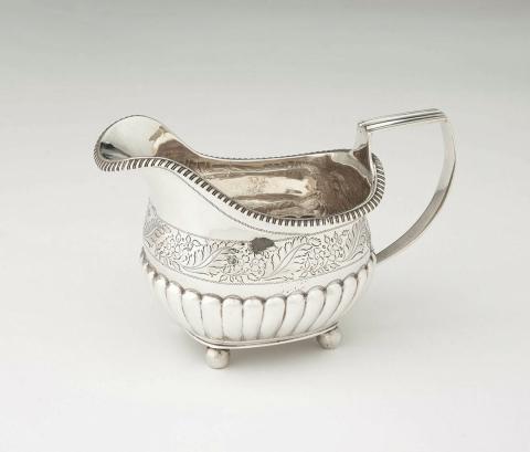 Artwork Cream jug this artwork made of Silver, ball feet with body half ridged and with engraved foliate band. Gadrooned lip, created in 1789-01-01