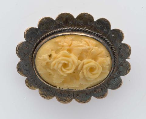 Artwork Brooch this artwork made of Brass and ivory