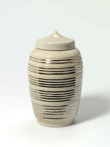 Artwork Covered jar this artwork made of Earthenware thrown white ridged body with greyish white glaze and bands of silver lustre, created in 1950-01-01