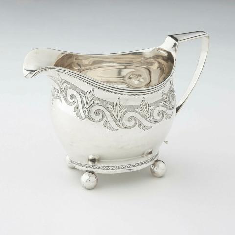 Artwork Cream jug this artwork made of Silver, on ball feet and engraved with scrolls, created in 1812-01-01
