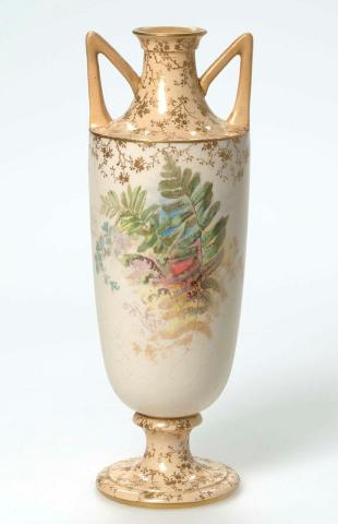 Artwork Vase this artwork made of Porcelain urn shaped vase transfer printed with leaves and ferns and hand coloured.  Gilt floral details on apricot ground on neck and foot.  Dull gilt sprayed rim and handles, created in 1891-01-01