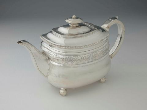 Artwork Teapot this artwork made of Silver, boat shaped engraved with a register of dolphins and shells. Gadrooned edge, created in 1805-01-01