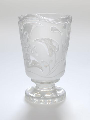 Artwork Footed beaker this artwork made of Clear glass cased white and wheel cut with a trailing vine motif, created in 1840-01-01