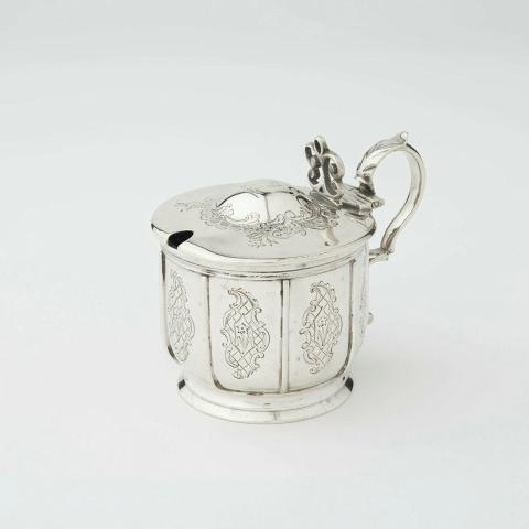 Artwork Mustard pot this artwork made of Silver engraved with floral scrolls and with blue glass liner, created in 1845-01-01