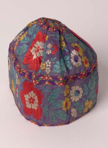 Artwork Baby's cap this artwork made of Silk brocade embroidered, created in 1870-01-01