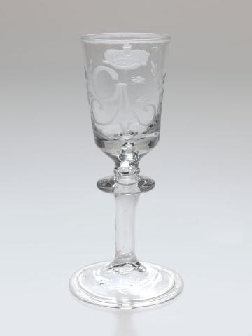 Artwork Goblet this artwork made of Glass, handblown with folded foot rim and engraved with stylised foliate motifs, a crown and "GAV" in monogram, created in 1740-01-01