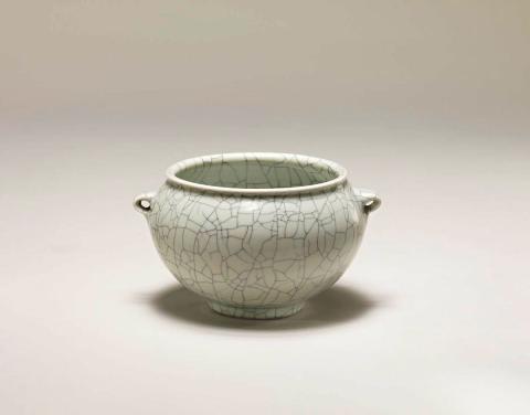 Artwork Kuan bowl this artwork made of Porcelain, thrown on three small feet.  Highfired to c.1450 degrees Celsius with crazed celadon glaze, created in 1980-01-01