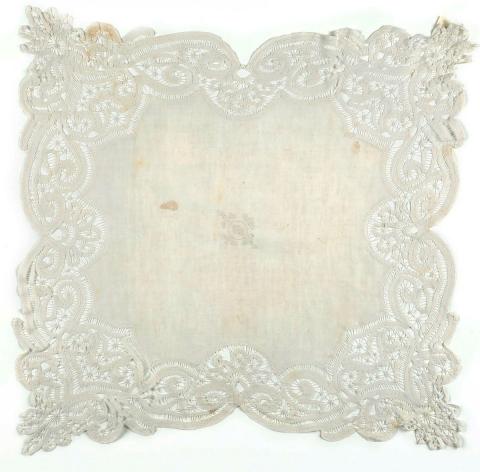 Artwork Tablecloth this artwork made of Linen cloth with tape lace border and central embroidered monogram, created in 1900-01-01