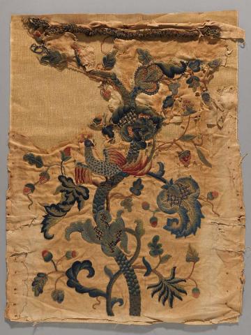 Artwork Textile fragment this artwork made of Worsted spun linen twill with crewel embroidery in polychrome wool. Braid attached, created in 1560-01-01