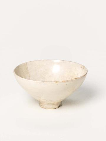 Artwork Footed bowl this artwork made of Stoneware, thrown white clay body with degraded white glaze.  Five pointel marks in bowl, created in 0960-01-01