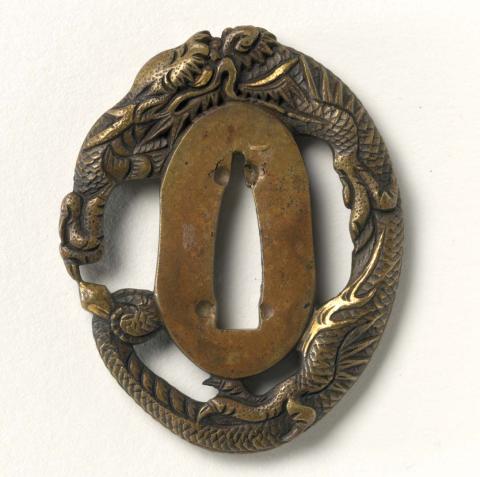 Artwork Tsubu (sword guard) this artwork made of Brass cast and chased with dragon design, created in 1975-01-01