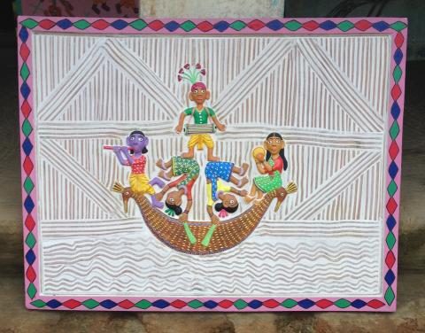 A sculptural panel with five acrobats in a boat dressed in colourful clothing.