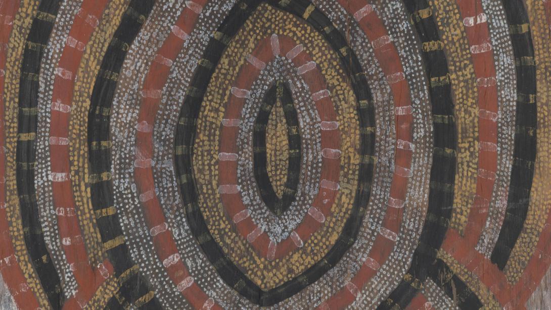 A work of concentric ovals in natural pigments on eucalyptus bark by Deaf Tommy Mungatopi (detail view)