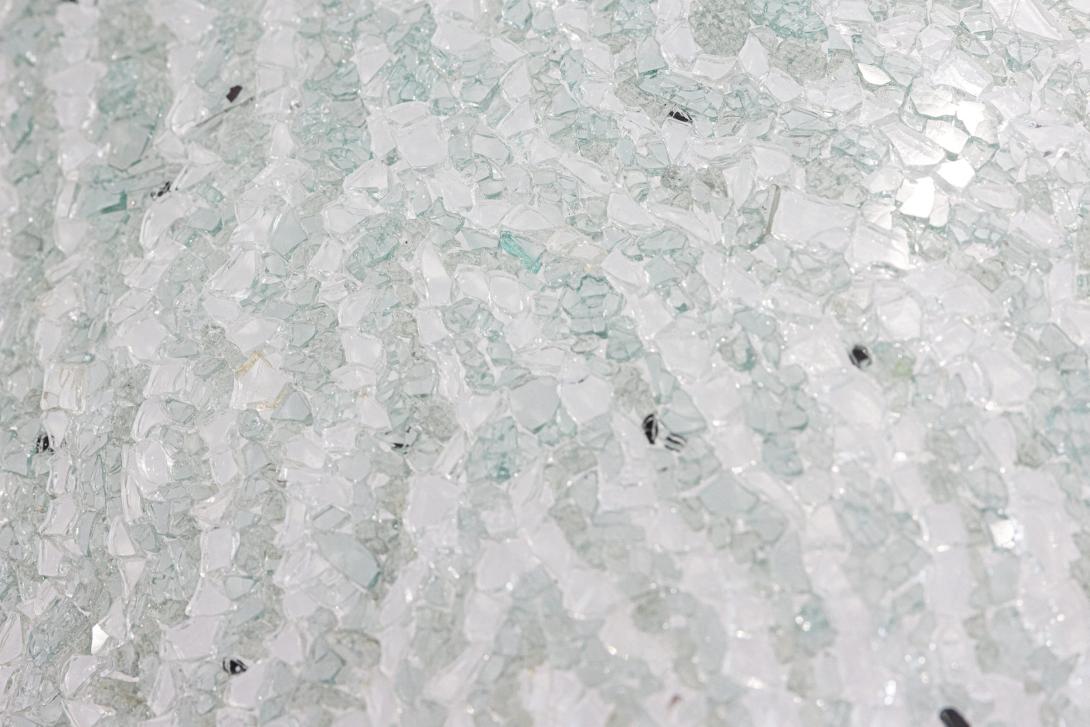 A detail view of a work made of shattered glass.