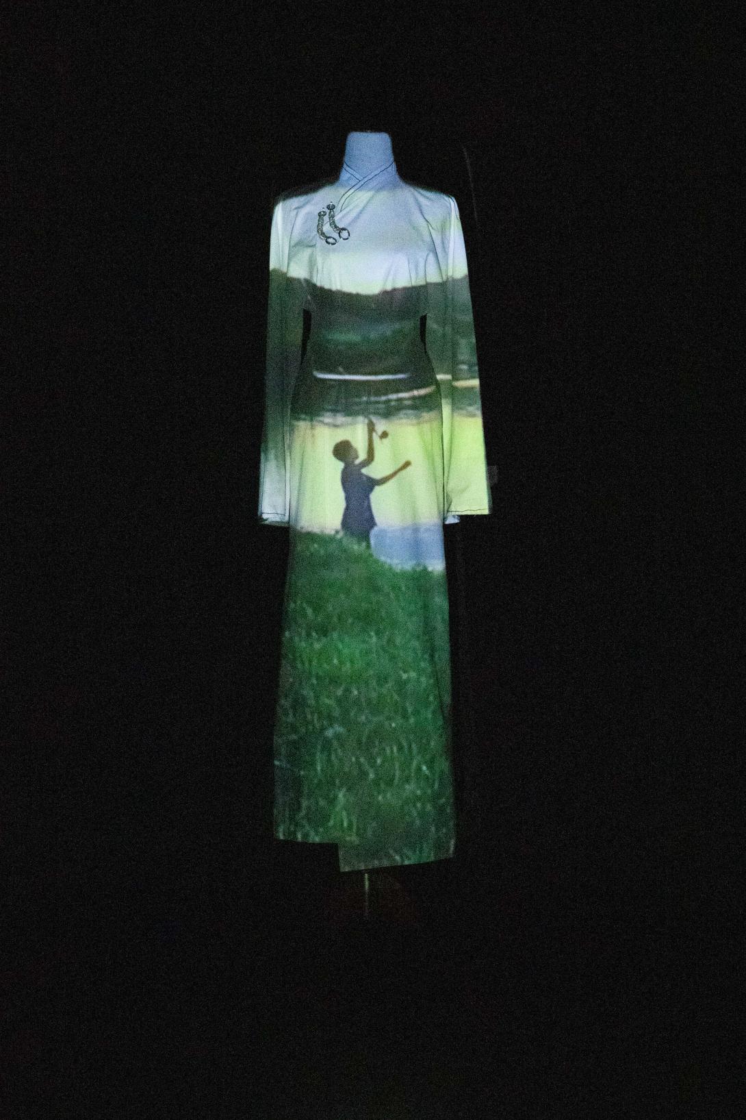 Artwork Nomadic this artwork made of Installation of single-channel video and cotton dress with glass beads