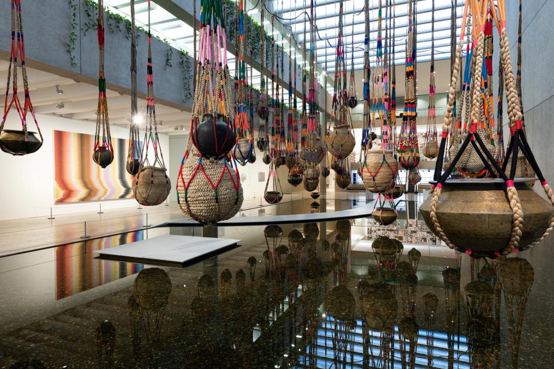 Large and colourful earthenware pots are pictured suspended over QAG's Watermall.