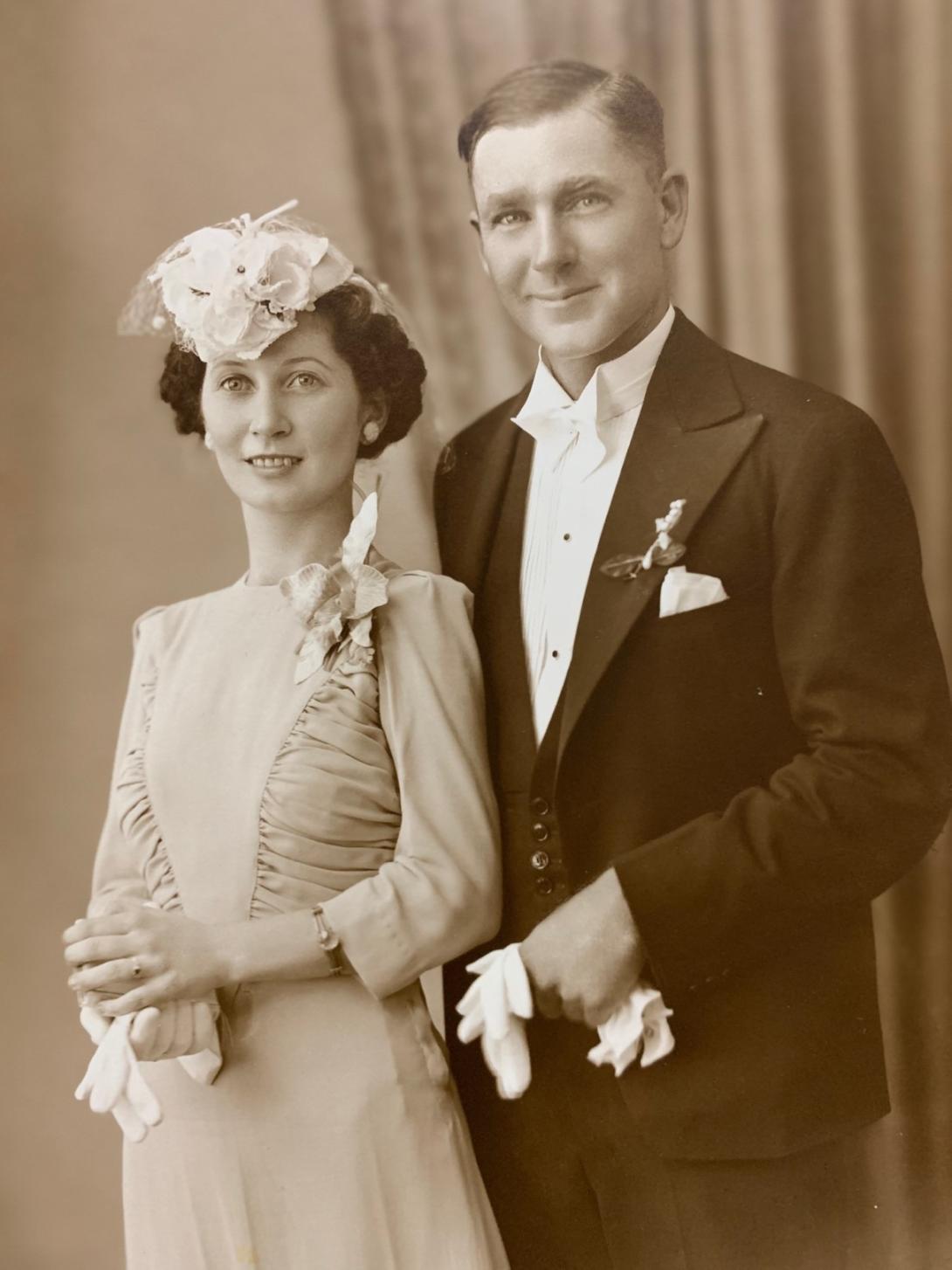 A vintage, sepid-toned photo of a wedding couple in 1940
