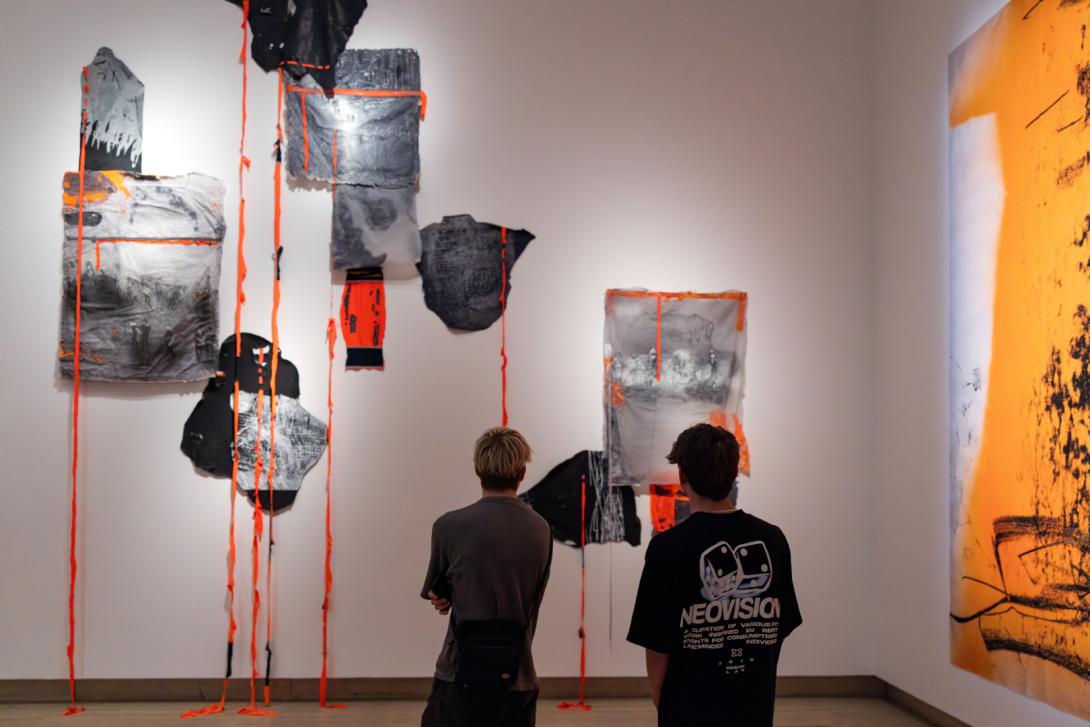 Assemblages by Pat Hoffie installed on a white gallery wall