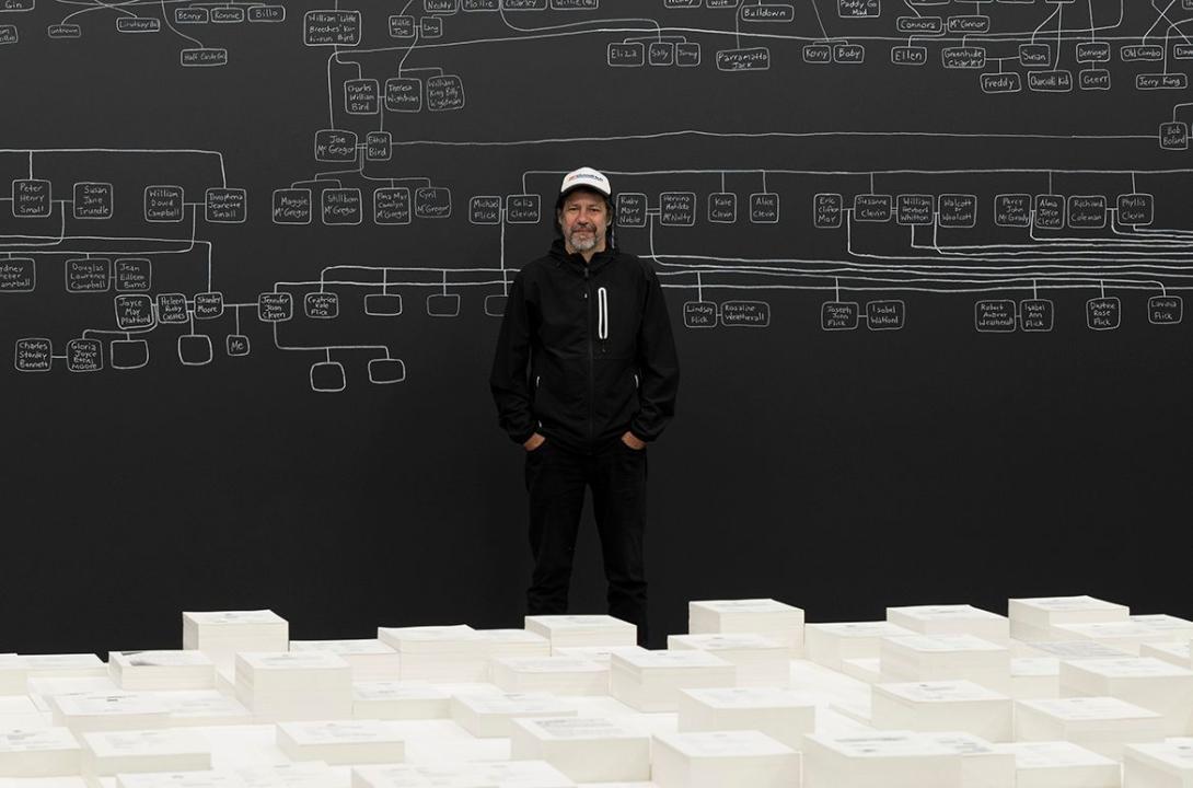 An artist stands with his room-scale installation work at the Australia Pavillion of the Venice Biennale