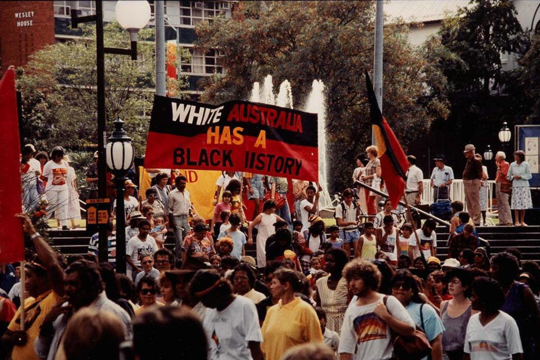 A detail view of a colour photo of a protest in an Australian city