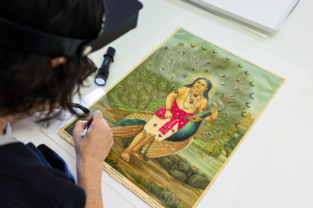 An oleograph print of a work by Raja Ravi Varma in the process of receiving conservation treatment