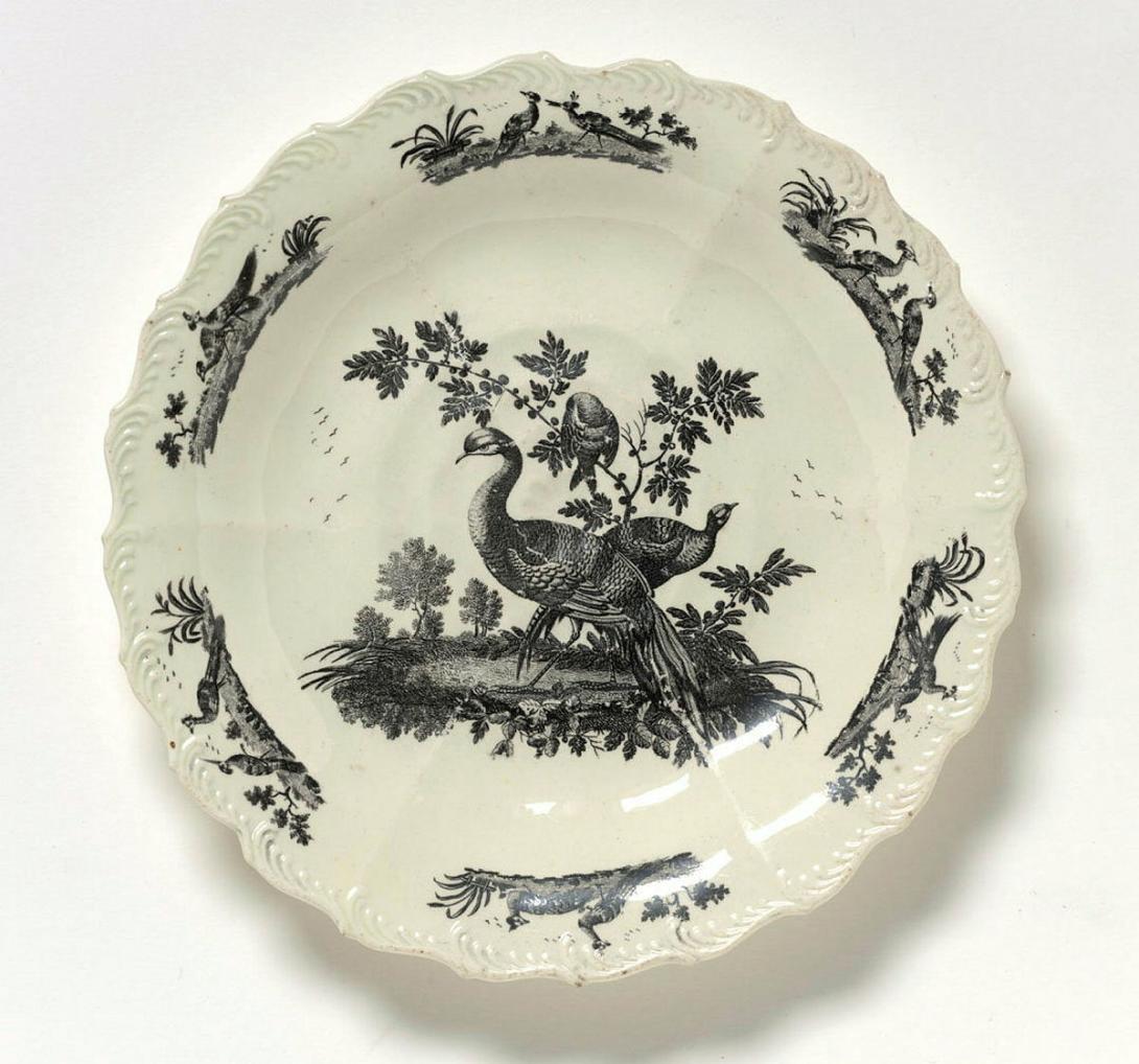 Artwork Plate this artwork made of Earthenware, creamware with feather edge border and moulded rose design in centre.  Black transfer print of 'liver birds' in centre and around rim, created in 1760-01-01