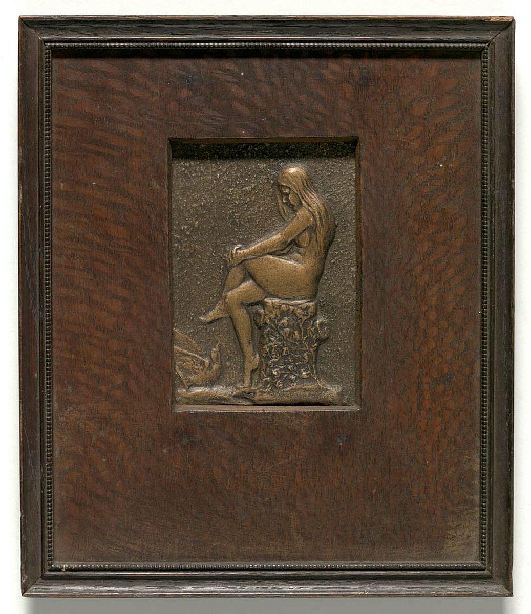 Artwork Plaque:  (seated nymph) this artwork made of Plaster bas relief with bronze paint. Framed, created in 1930-01-01