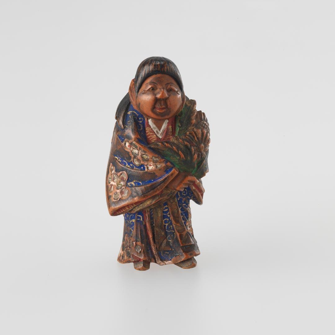 Artwork Netsuke:  (Nara doll) this artwork made of Carved wood with polychrome details, created in 1850-01-01