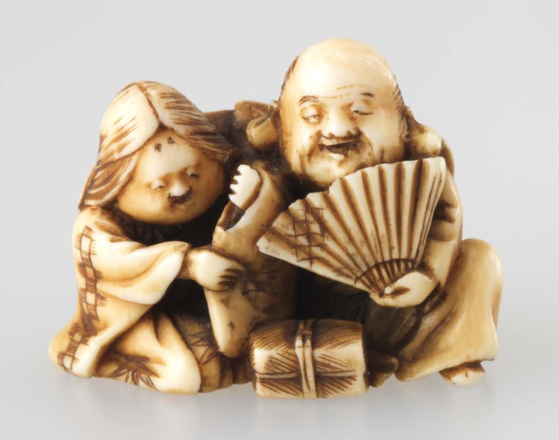 Artwork Netsuke:  (man and woman seated) this artwork made of Carved ivory, created in 1800-01-01