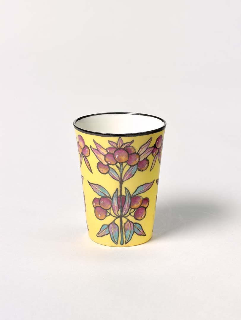 Artwork Beaker this artwork made of China painting on bone china blank in magenta, yellow and blue outlined background and yellow ground.  Black rim