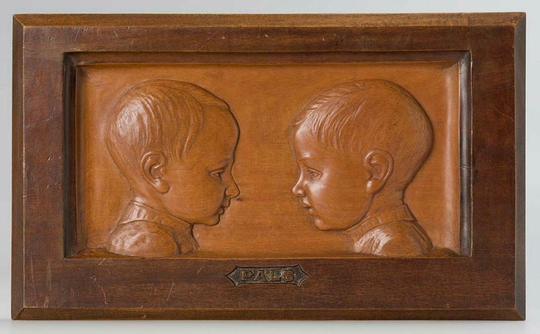 Artwork Plaque:  Pals this artwork made of Carved Queensland beech, created in 1940-01-01